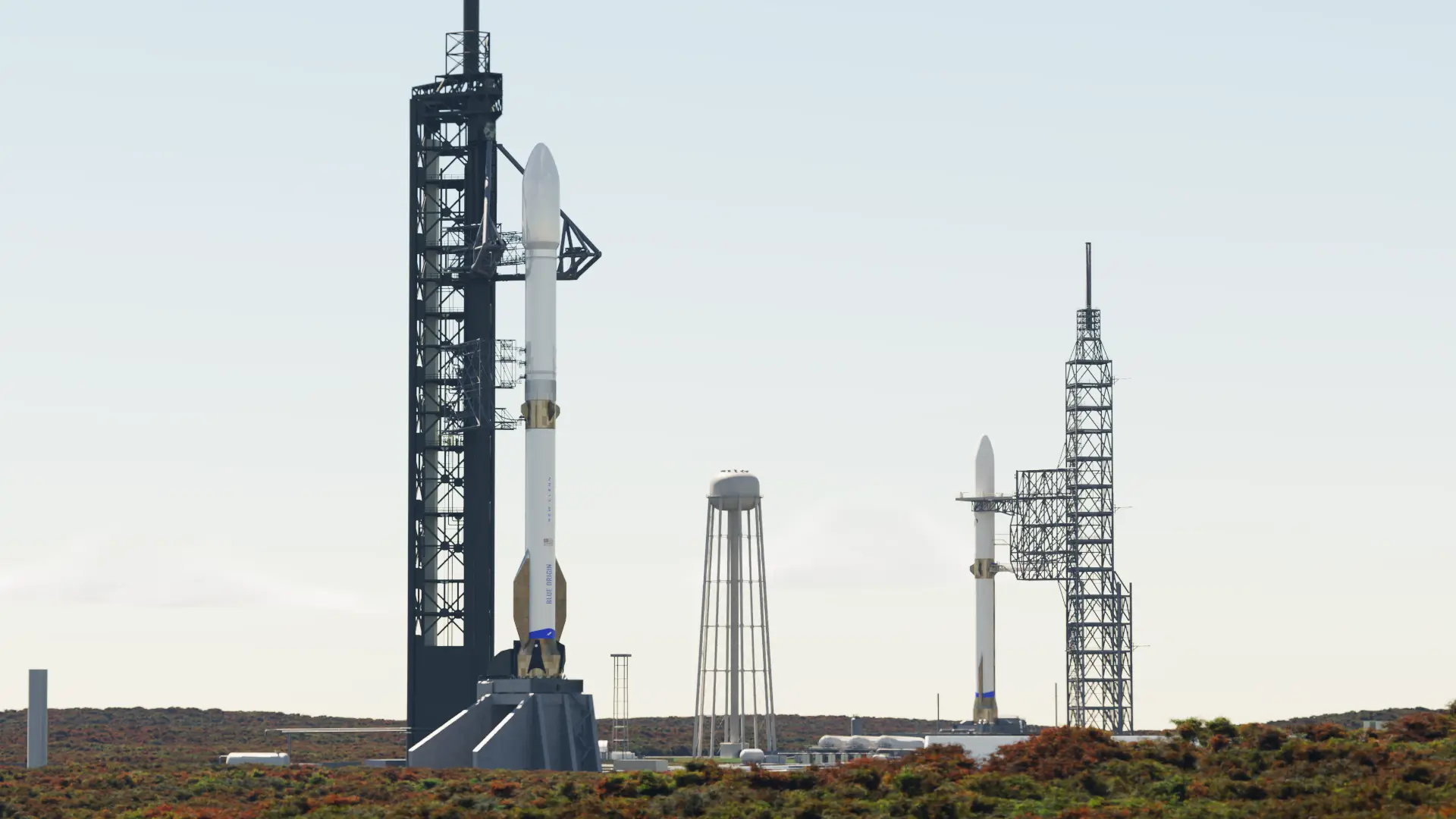 航天图片资料 · Two rockets stand at neighboring launch towers.