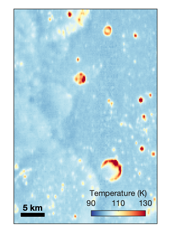 航天图片资料 · Animated temperature map that alternates between two images. A vertical strip through the center blinks on and off, revealing a dark blue circular area surrounding a small white spot near the middle. The pale blue map also contains scattered yellow, orange, and red spots and rings, including a large, curved red-and-yellow feature near the lower center. A 5-kilometer scale bar appears at lower left, and a color key ranges from 90 kelvin in dark blue to 130 kelvin in dark red.