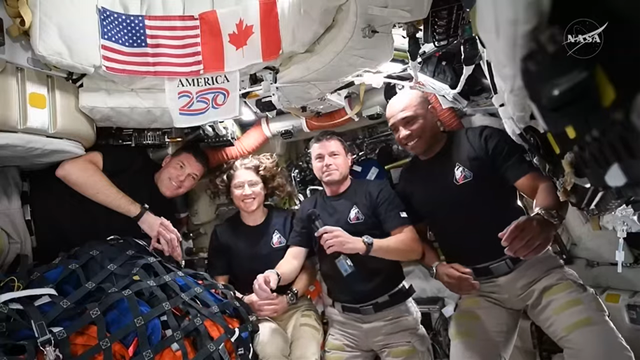 航天图片资料 · The four Artemis II crew members participate in a live downlink on flight day six, following the conclusion of their lunar flyby.