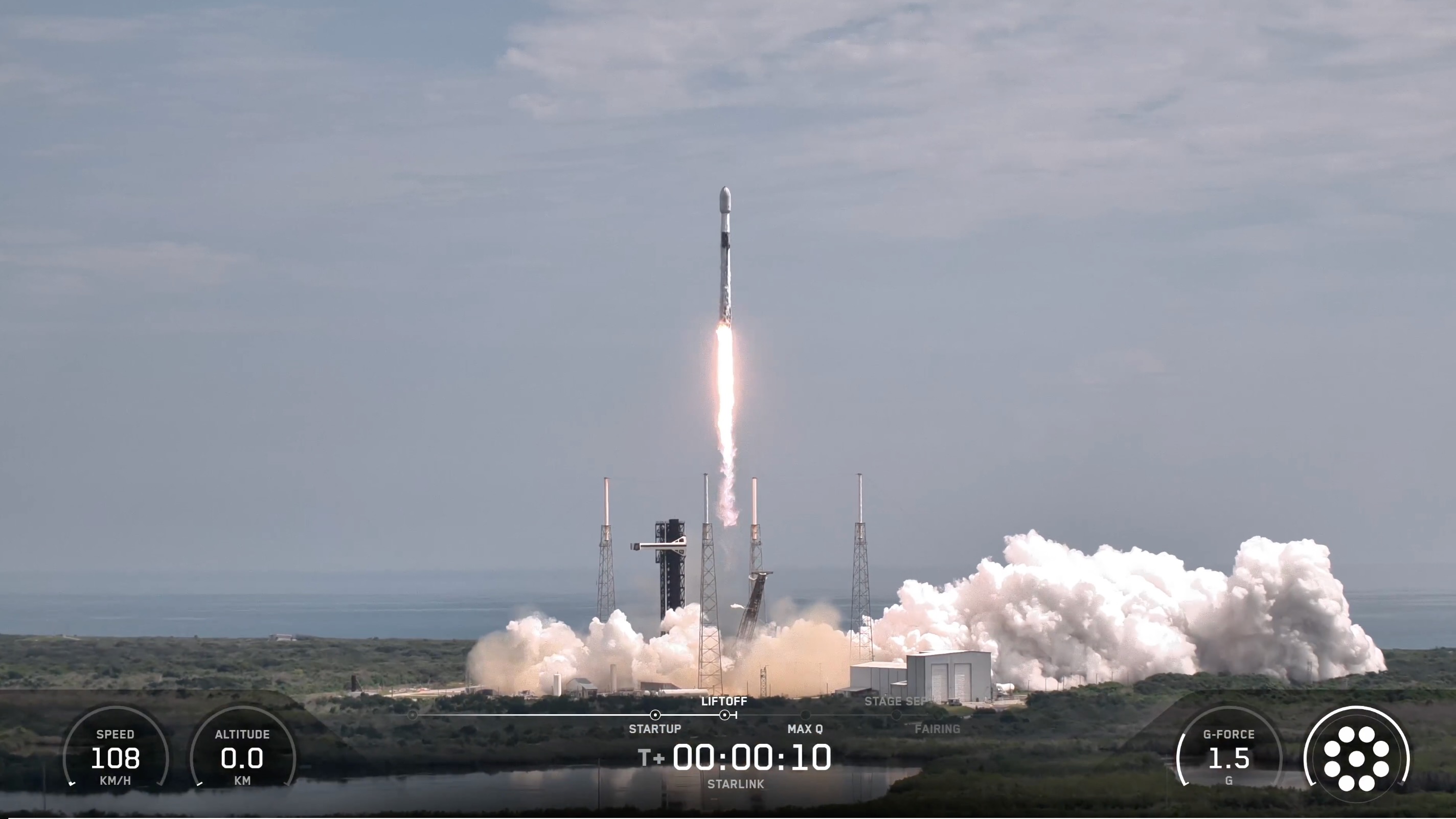 航天图片资料 · a black and white rocket launches from a seaside pad