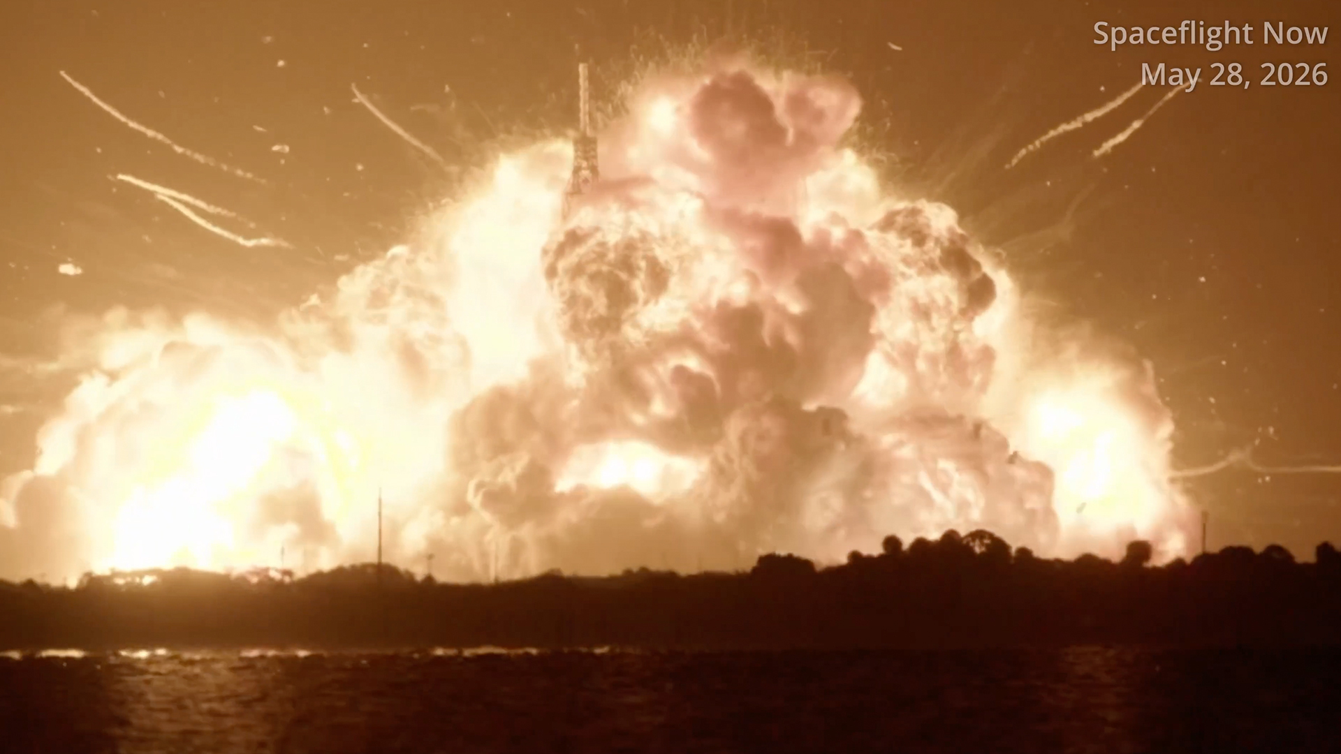 航天图片资料 · a massive fireball can be seen over a distant treeline