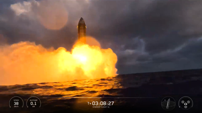 航天图片资料 · Rocket nose cone of rocket visible above a massive explosion of orange fire and smoke over the ocean.