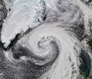 航天图片资料 · Storm clouds in an expanding spiral are centered near southern Iceland. The system extends across the North Atlantic from Greenland to the UK.