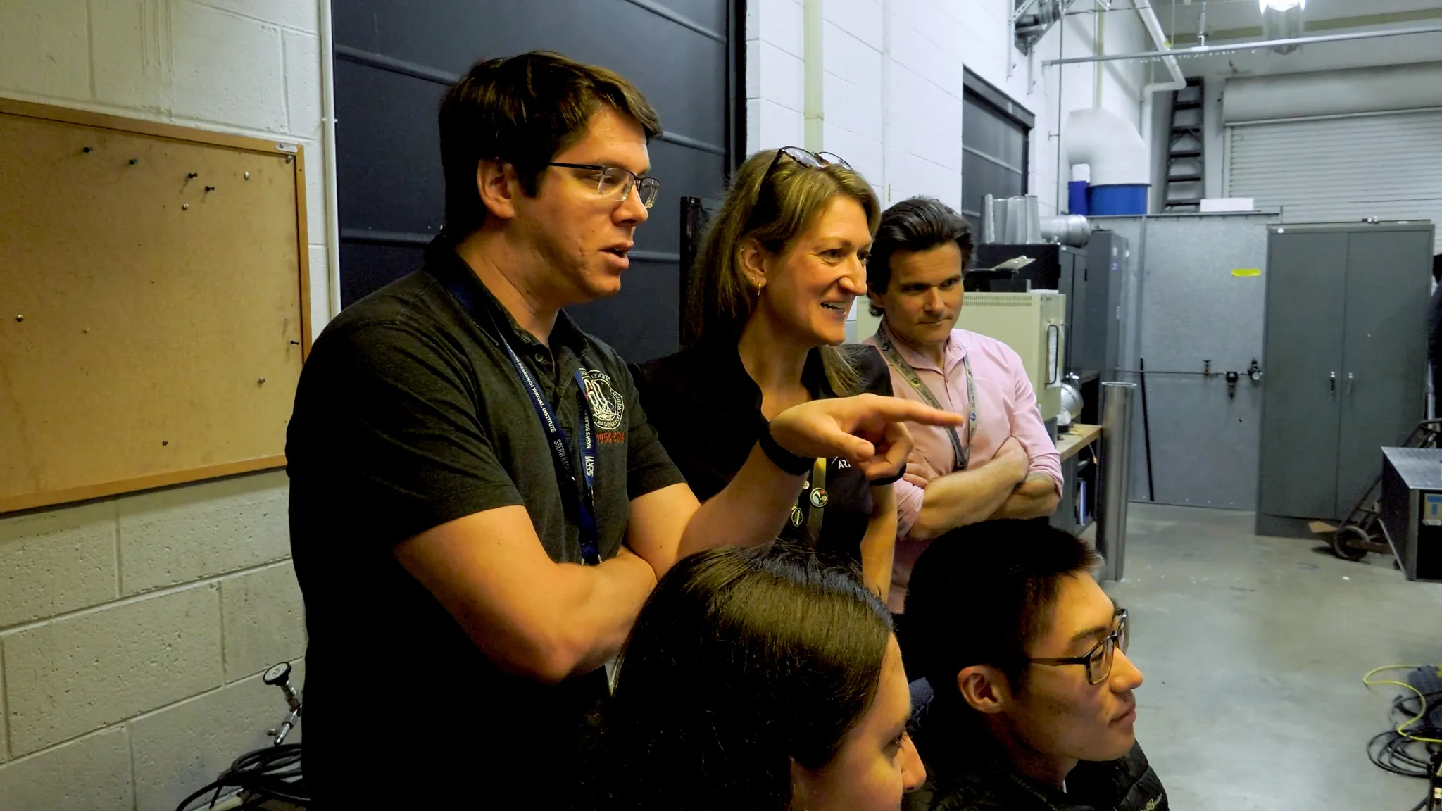 航天图片资料 · Clockwise from left: Wesley Chambers, deputy principal investigator for the PSI tests from Marshall’s Space Flight Center in Huntsville, Alabama; Ashley Korzun, test lead and principal investigator; Dave Lehotay, project manager; and Tylor Takahashi and Olivia Tyrrell, both from the SCALPSS instrument team, watch test footage in the control room.