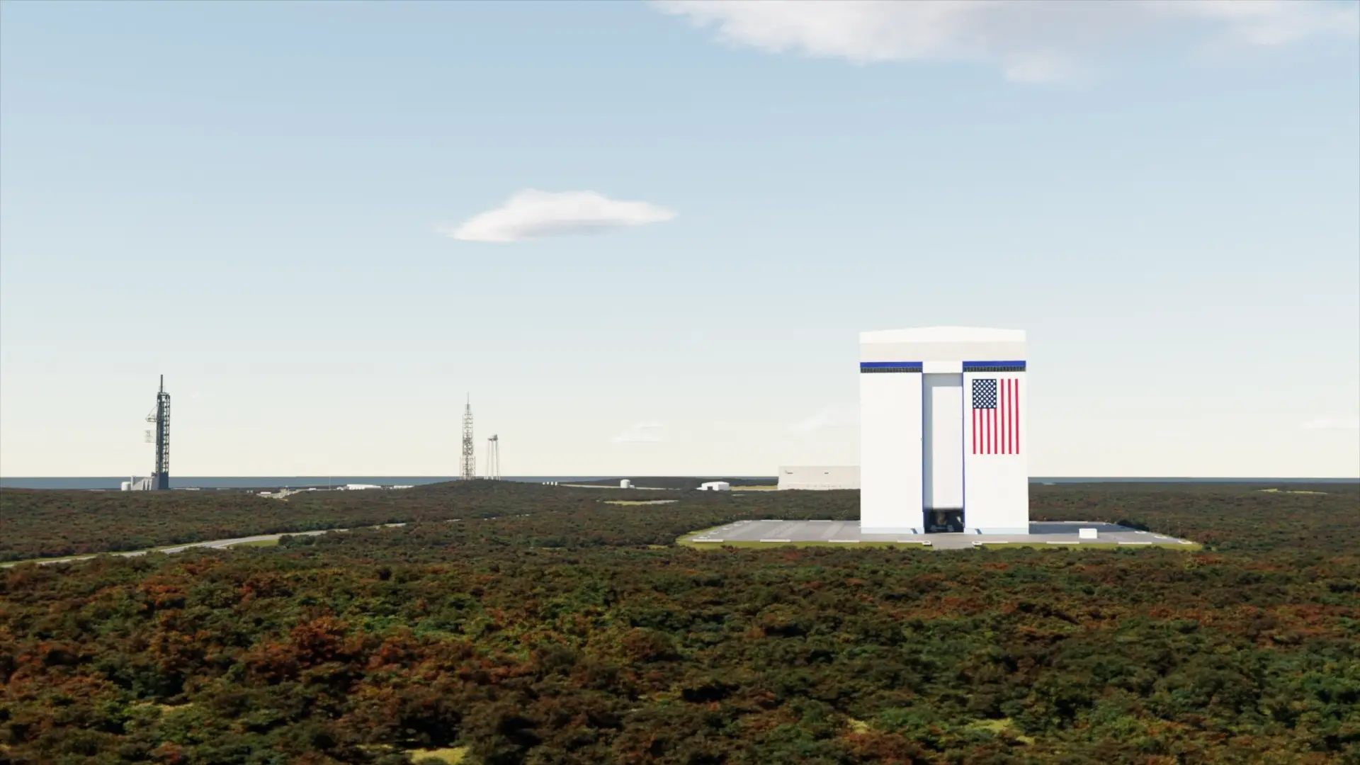 航天图片资料 · A square building stands on a flat landscape with a pair of rocket launch towers in the background.