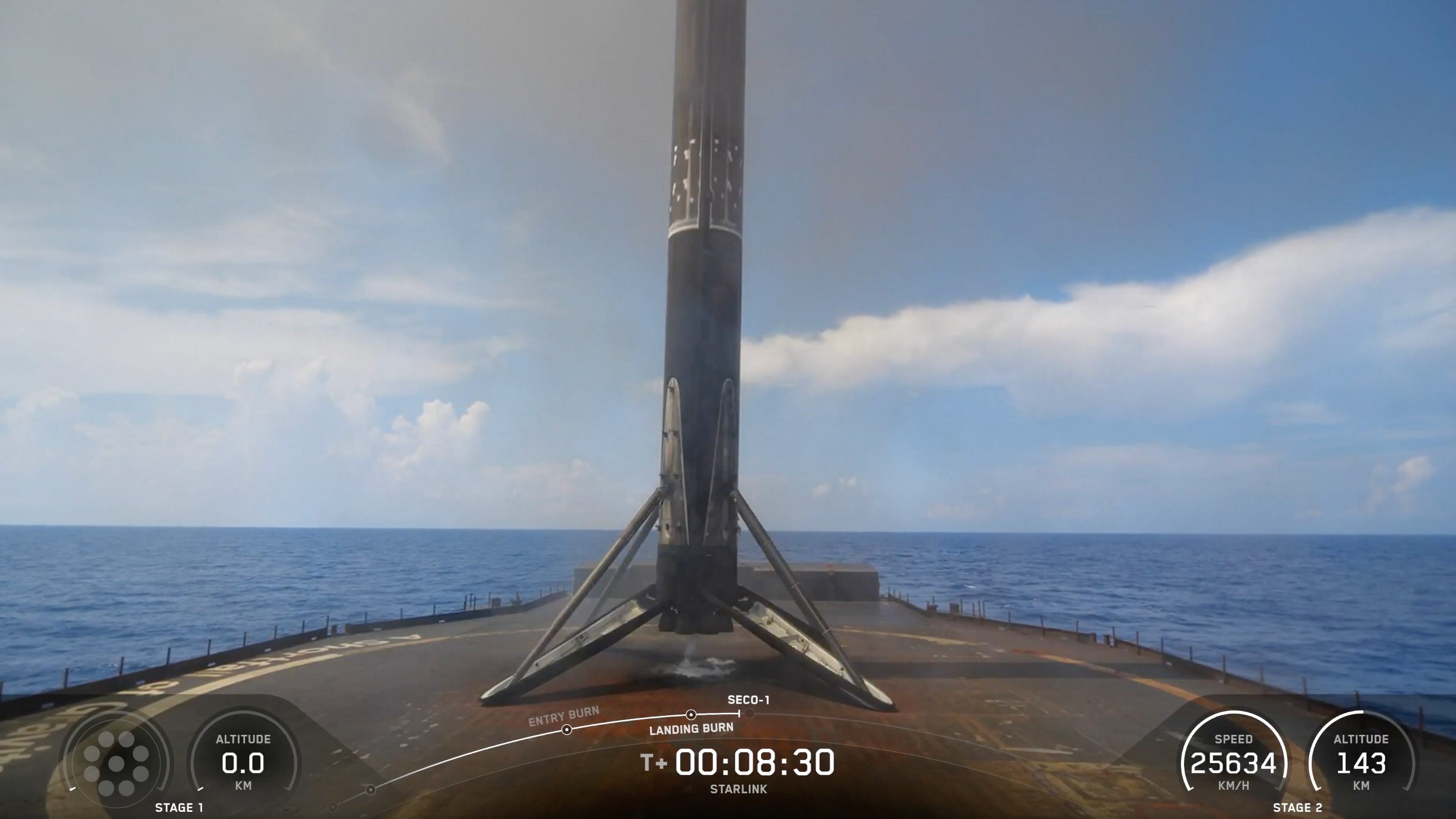 航天图片资料 · A black and white spacex falcon 9 rocket first stage sits on the deck of a ship at sea.
