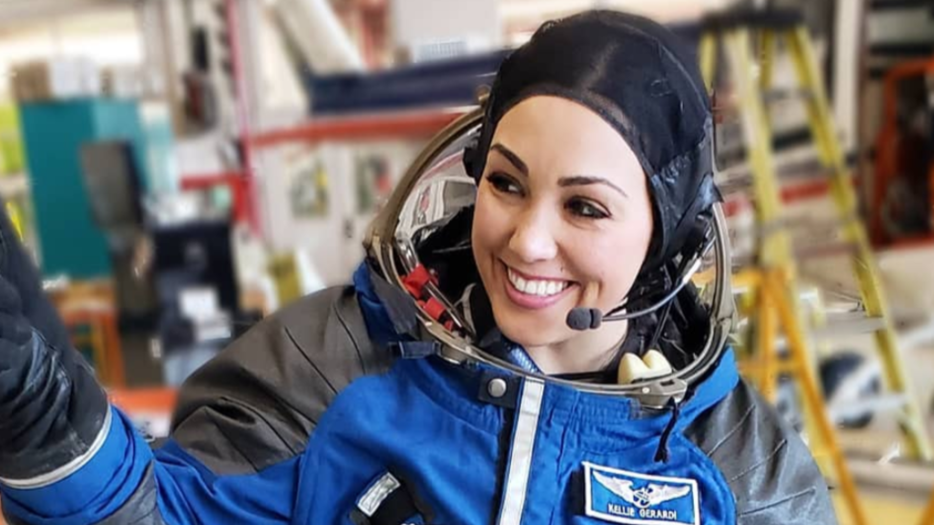 航天图片资料 · Kellie Gerardi in a blue flight suit.