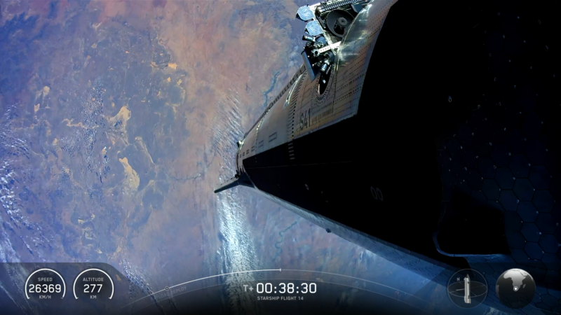 航天图片资料 · View of flat, metallic side of spacecraft in high orbit over Earth.