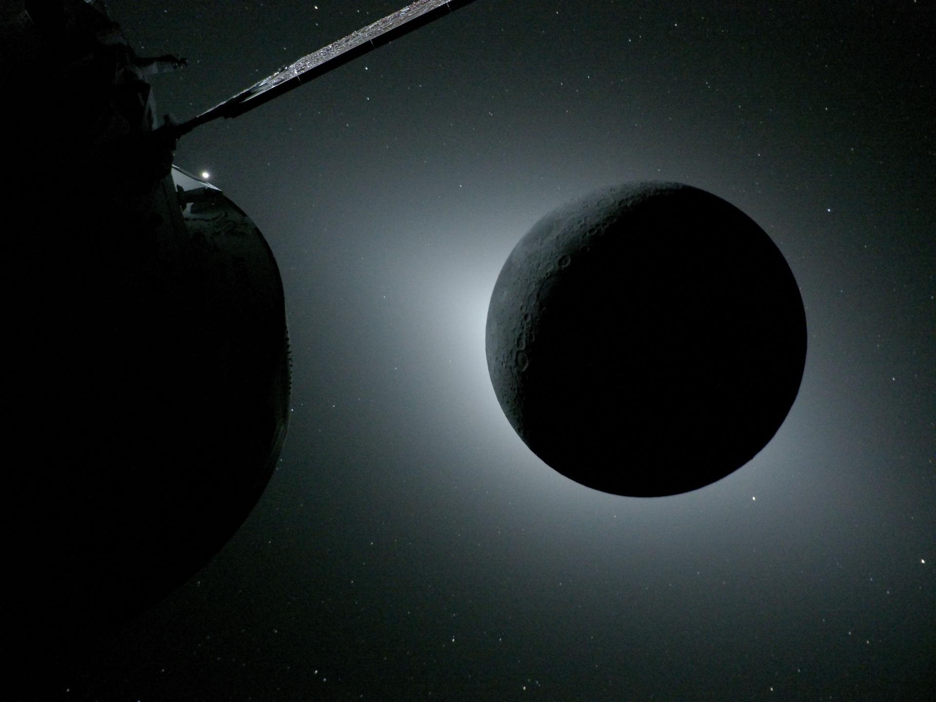 航天图片资料 · The Moon, backlit by the Sun during a solar eclipse, is photographed by NASA’s Orion spacecraft on April 6, 2026, during the Artemis II mission. Orion is visible in the foreground on the left. Earth is reflecting sunlight at the left edge of the Moon, which is slightly brighter than the rest of the disk. The bright spot visible just below the Moon’s bottom right edge is Saturn. Beyond that, the bright spot at the right edge of the image is Mars.