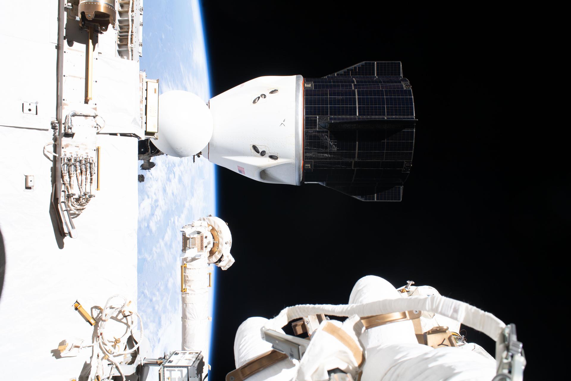 航天图片资料 · This photograph of the SpaceX Dragon spacecraft, which launched four Crew-12 members to the International Space Station on Feb. 13, 2026, and docked to the Harmony module the next day, was captured during a spacewalk by NASA astronaut and Expedition 75 flight engineer Anil Menon.
