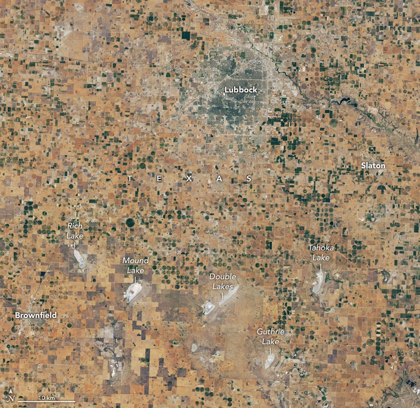 航天图片资料 · A satellite image of the same Lubbock region on September 9, 2026, appears parched, with much less green vegetation and mostly dry lakes.