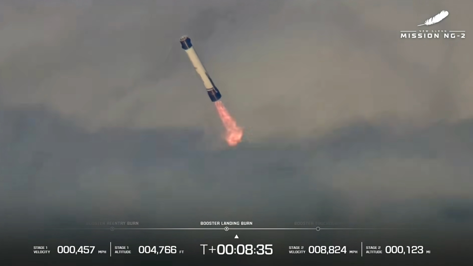 航天图片资料 · a large white-and-blue rocket fires its engines as it descends through clouds