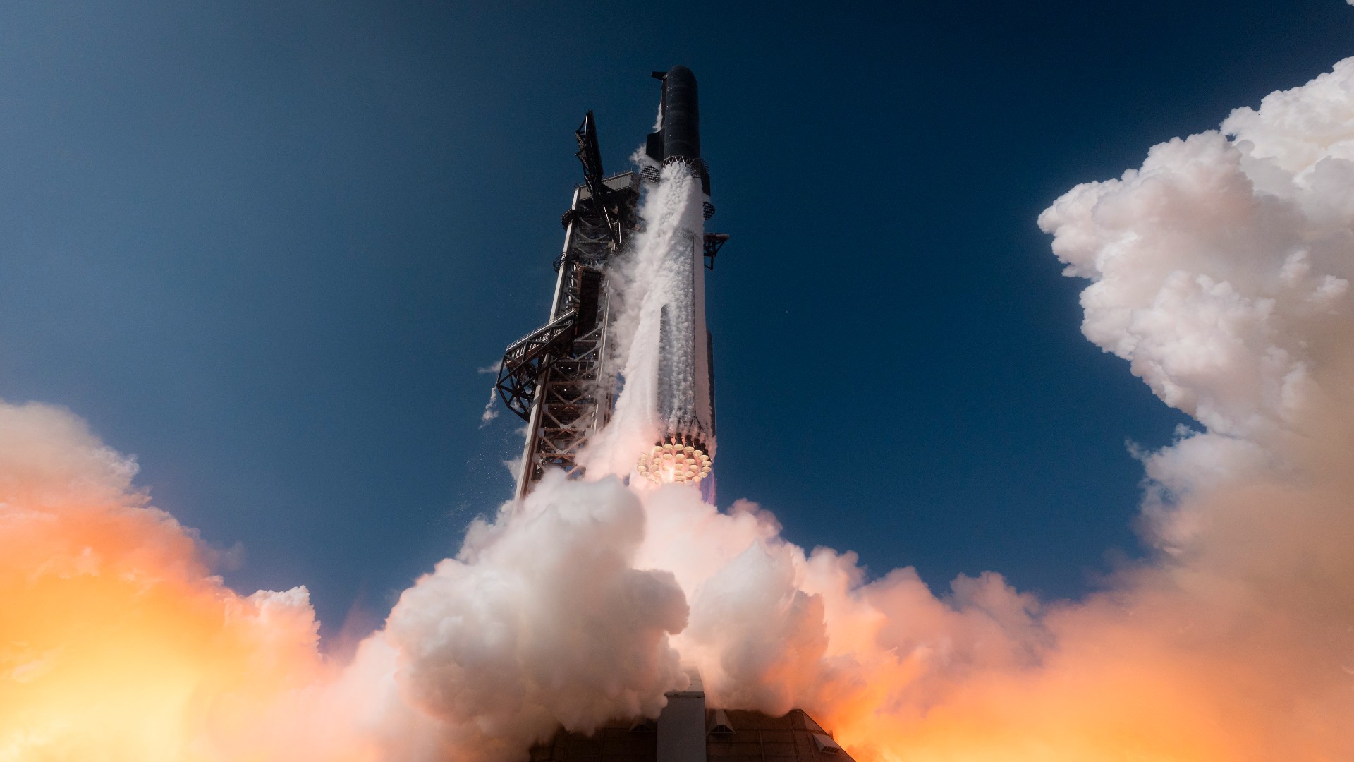 航天图片资料 · a large silver rocket launches above a plume of fire