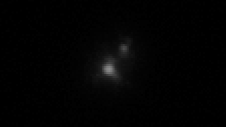 航天图片资料 · a black and white image of a grainy object rotating against a black background