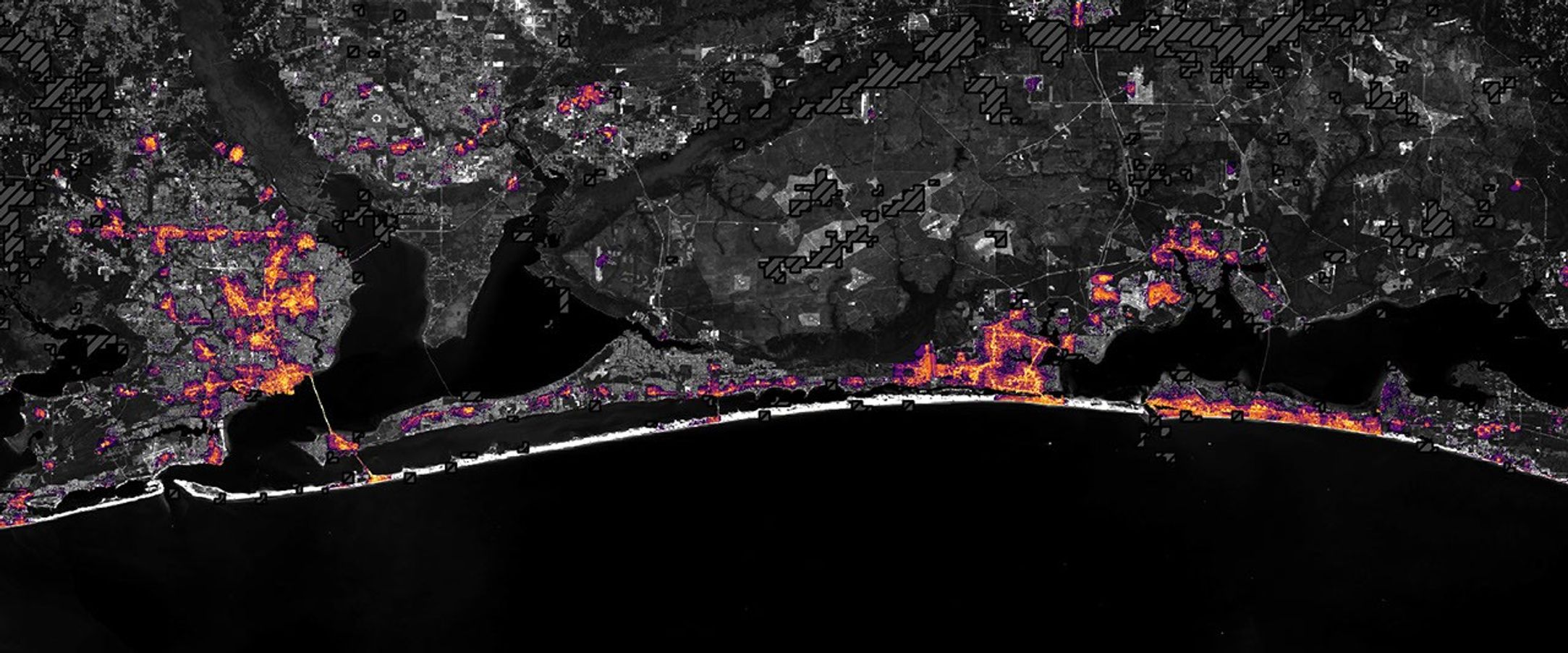航天图片资料 · The same area on October 12, 2026, with lights in Pensacola and Destin and along the road between them closer to pre-storm levels.