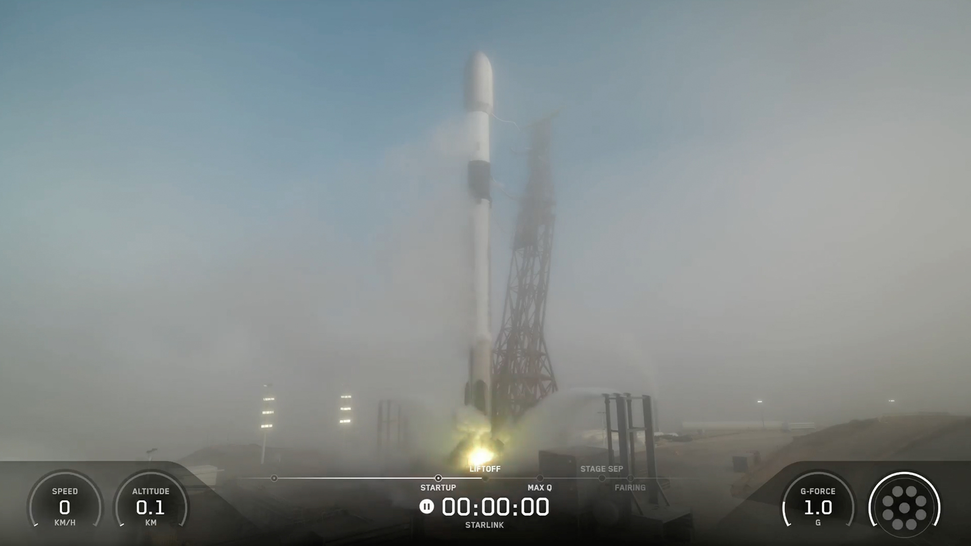 航天图片资料 · a white rocket upright on a launch pad, partially obscured by fog