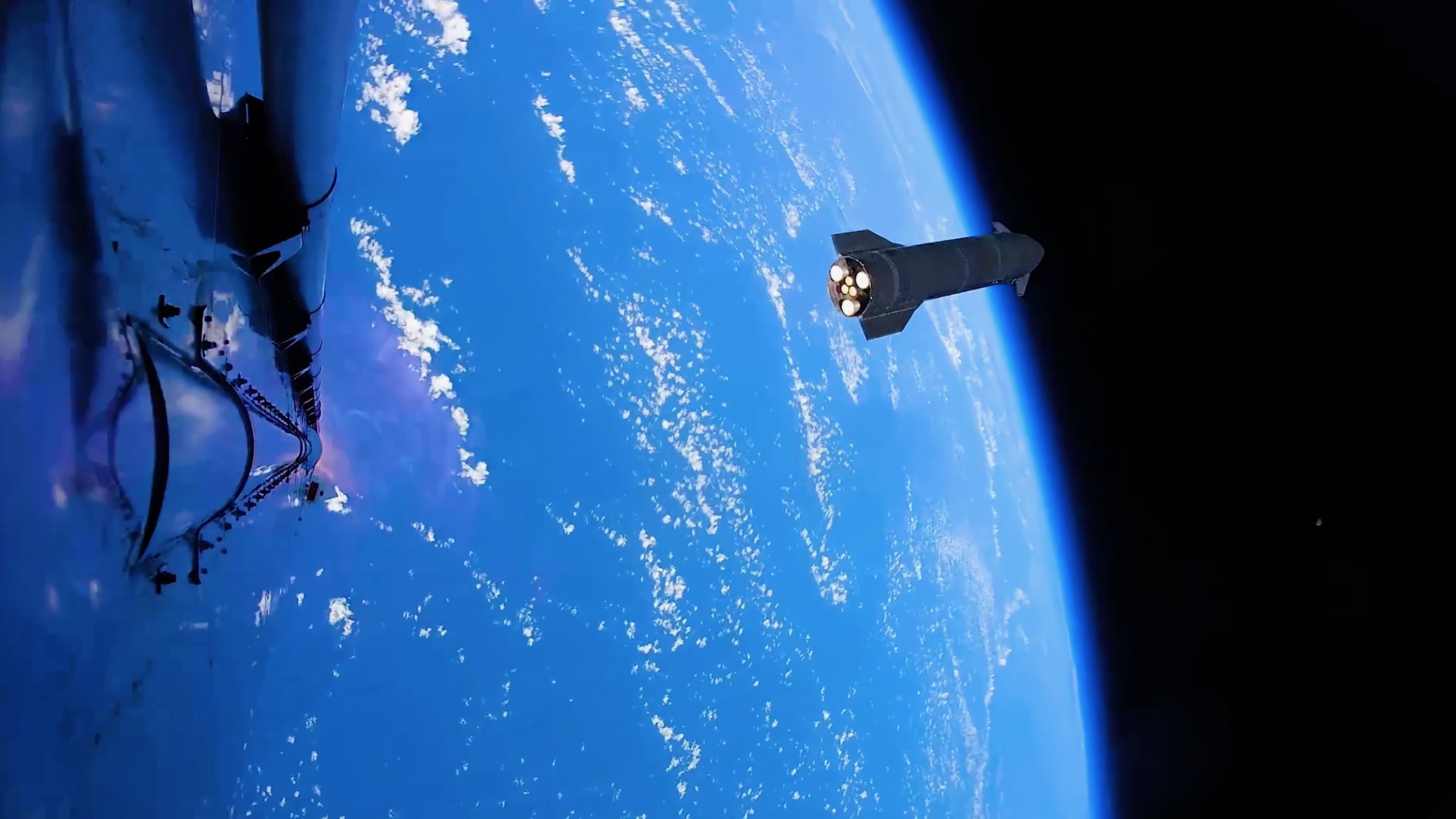 航天图片资料 · a dark, conical spaceship is seen high above Earth from another spacecraft in space