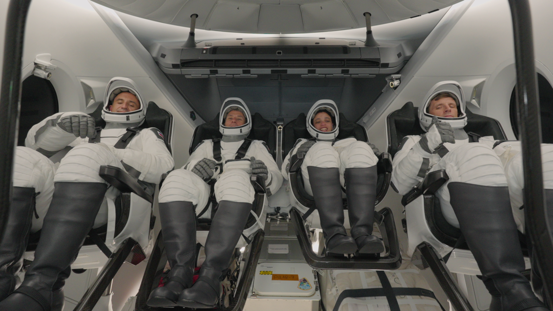 航天图片资料 · Four astronauts in a spacecraft.