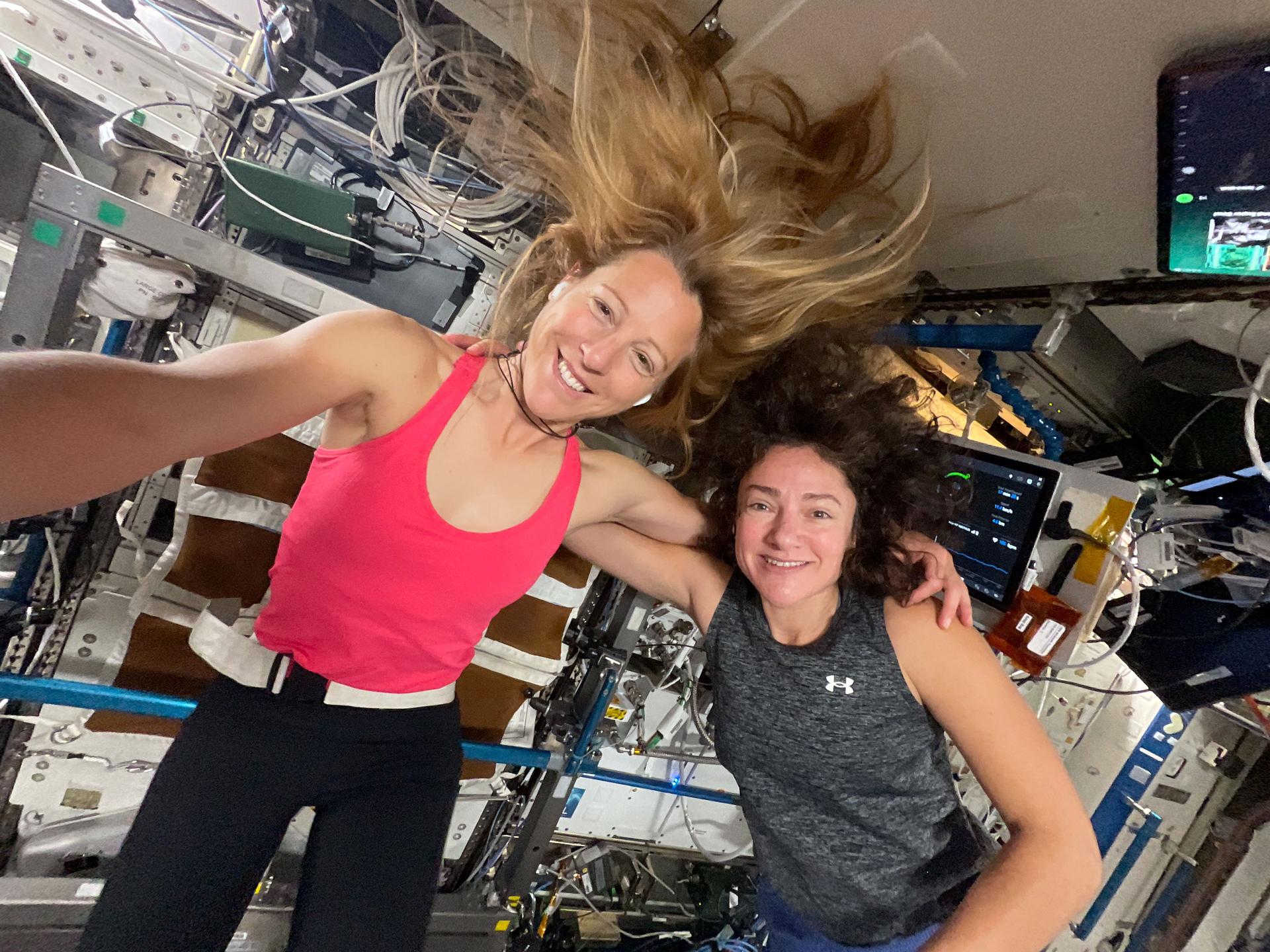 航天图片资料 · Expedition 74 Flight Engineers (from left) Sophie Adenot of ESA (European Space Agency) and Jessica Meir of NASA take a portrait together before beginning their exercise sessions. Afterward, Adenot worked out on the Advanced Resistive Exercise Device (ARED), which mimics free weights on Earth, while Meir jogged on the COLBERT treadmill. Both exercise devices are located inside the Tranquility module.