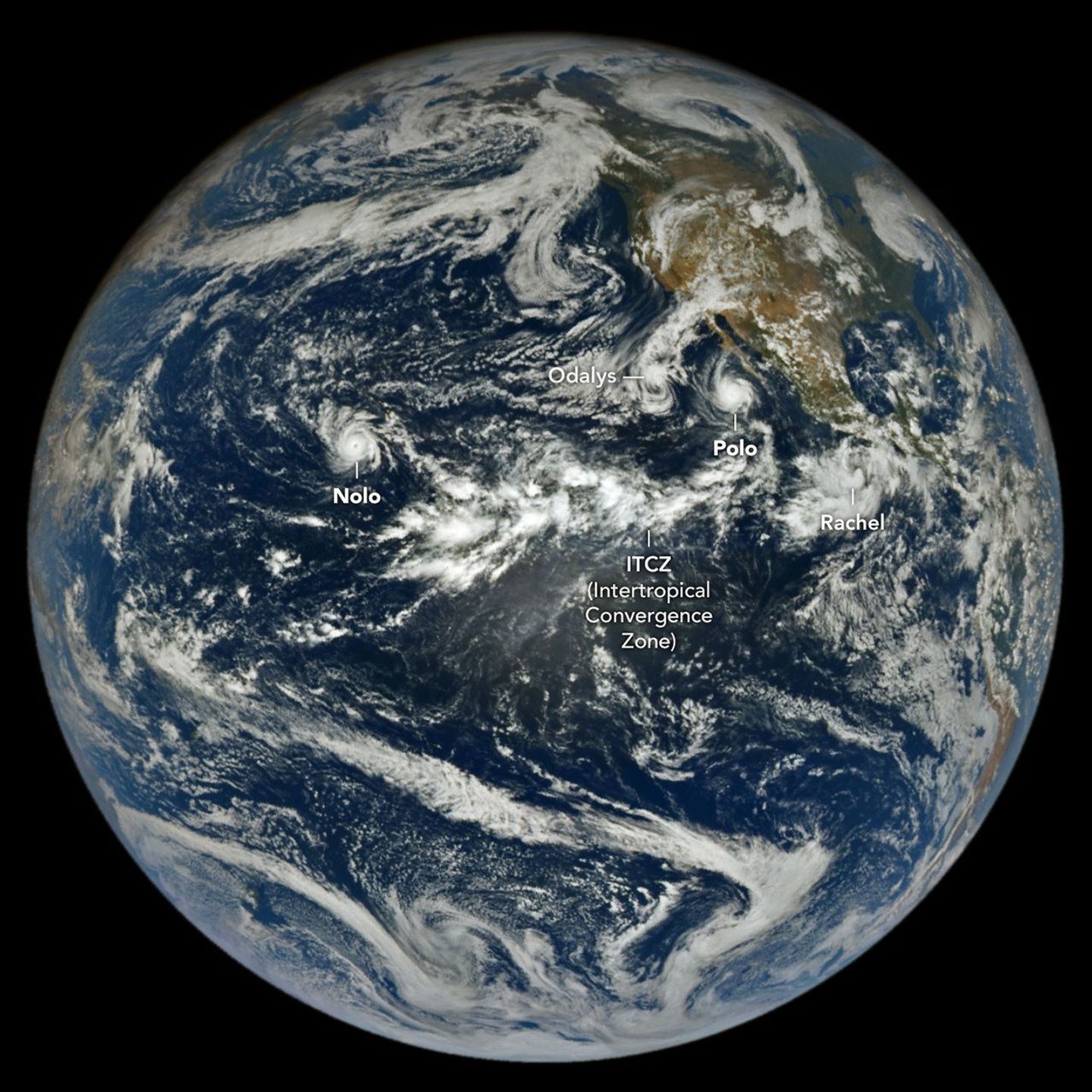 航天图片资料 · In a full-disk satellite view of Earth, several tropical cyclones swirl above the blue waters of the Pacific Ocean.