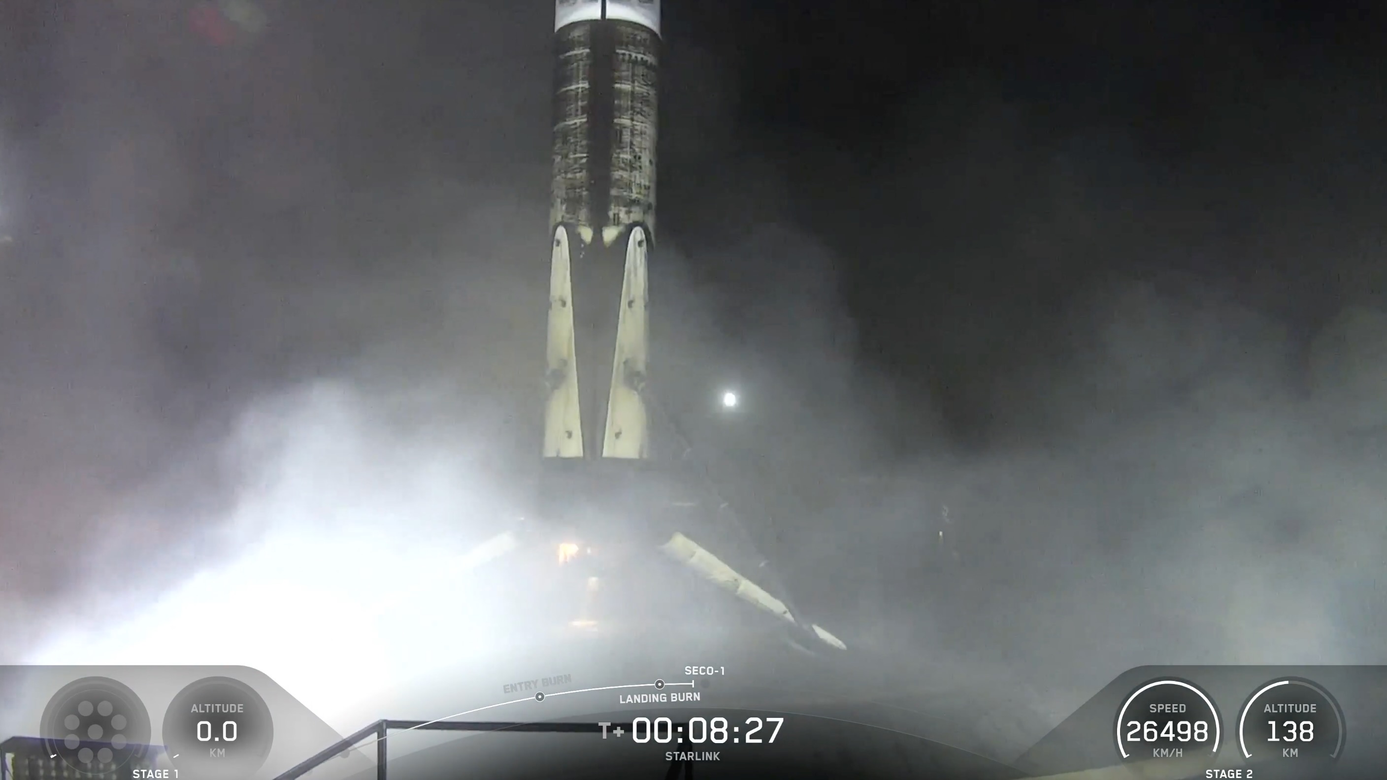 航天图片资料 · A black and white spacex falcon 9 rocket first stage sits on the deck of a ship at sea.